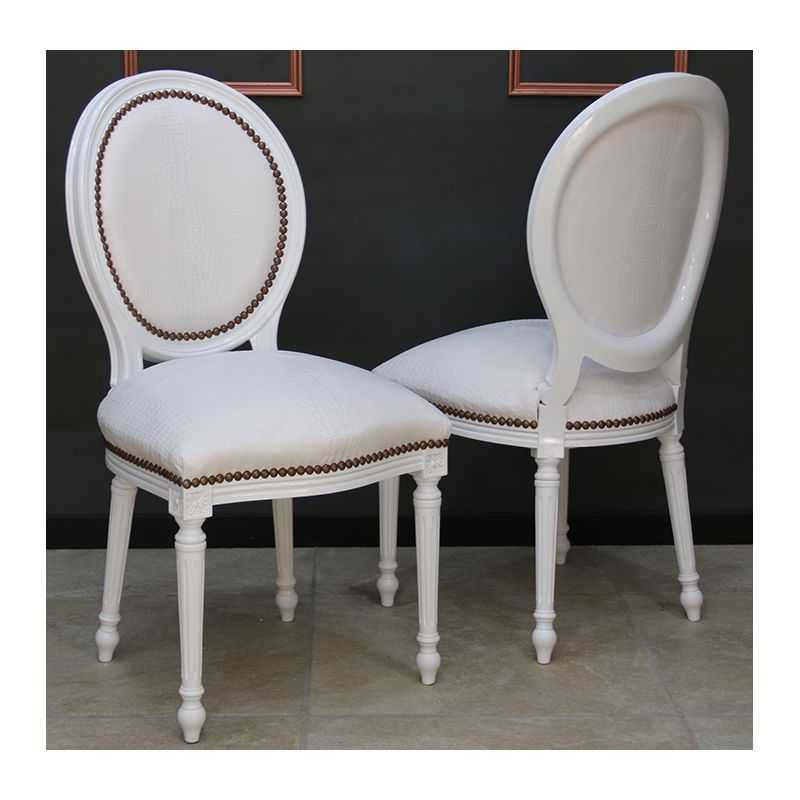LOT 6 CHAISES MEDAILLON - Laque blanche - Simili cuir Croco blanc - "PROMO -20%"Lot 6 chaises Médaillon en stock au prix de 199€ TTC unitaire au lieu de 249€ TTC. Fabrication en bois de hêtre 100 % massif. Garniture de tapissier avec sangles, crin et ressorts. Chaises très confortables, adaptées aux gabarits grands et/ou forts, avec une hauteur d’assise de 50 cm et une hauteur totale de 101 cm.