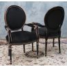LOT 8 CHAISES MEDAILLON DONT 2 AVEC ACCOUDOIRS - Vernis Noir et Brut - Velours Noir - "PROMO STOCK -20%"Lot 8 Chaises Médaillon en stock au prix de 199€ l’unité au lieu de 249€ dont 2 sont avec accoudoirs. (58/62cm de largeur au lieu de 48/50)La finition du bois est réalisée avec un vernis noir appliqué sur le hêtre massif. Après vernissage, certaines parties et certains reliefs sont poncés manuellement à la main afin de faire réapparaître volontairement le bois brut sous la finition noire.Ce travail artisanal crée un effet patiné et légèrement vieilli, avec un contraste naturel entre le noir verni et le bois brut apparent. Cette finition est associée à un revêtement en velours noir.Caractéristiques :Style : Louis XVI / MédaillonStructure : hêtre 100% massifFabrication : renforcée pour une utilisation quotidienne ou intensiveUtilisation : particuliers, restaurants, hôtels, cafés et professionnelsRevêtement : velours noir moderneFinition : bois verni noir avec ponçage manuel faisant apparaître le bois brut par endroitsEffet : patiné et légèrement vieilliHauteur d’assise : 48/50 cmHauteur totale : 100/101 cmLargeur : 48/50cm