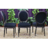LOT 12 CHAISES MEDAILLON STYLE LOUIS XVI - Vernis noir marbré - "PROMO STOCK -20%"Lot 12 Chaises Médaillon en stock au prix de 199€ l’unité au lieu de 249€.La finition du bois est réalisée avec un vernis noir appliqué sur le hêtre massif. Après vernissage, certaines parties et certains reliefs sont poncés manuellement à la main afin de faire réapparaître volontairement le bois brut sous la finition noire.Ce travail artisanal crée un effet patiné et légèrement vieilli, avec un contraste naturel entre le noir verni et le bois brut apparent. Cette finition est associée à un revêtement en velours noir.Caractéristiques :Style : Louis XVI / MédaillonStructure : hêtre 100% massifFabrication : renforcée pour une utilisation quotidienne ou intensiveUtilisation : particuliers, restaurants, hôtels, cafés et professionnelsRevêtement : velours noir moderneFinition : bois verni noir avec ponçage manuel faisant apparaître le bois brut par endroitsEffet : patiné et légèrement vieilliHauteur d’assise : 48/50 cmHauteur totale : 100/101 cmLargeur : 48/50cm