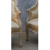 Lot 2 Fauteuils Bergères en Gondole Style Louis XV - Bois patiné feuille d'or blanc avec un tissu crème et or