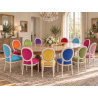LOT 6 CHAISES MEDAILLON MULTICOLORES - Bois cérusé blanc - "PROMO -20%"Ensemble de 6 chaises Médaillon de style Louis XVI avec finition bois cérusé blanc. Le lot est composé de plusieurs coloris : chaque chaise possède une couleur de velours différente.La structure est fabriquée en hêtre 100 % massif. Ces chaises offrent une assise large et confortable et conviennent aussi bien à un intérieur particulier qu’à un usage professionnel, notamment pour les restaurants, hôtels et salles de réception.Prix stock : 199€ TTC par chaise, dans la limite des modèles et coloris disponibles immédiatement.Notre stock comprend généralement entre 10 et 20 teintes de velours moderne. Pour une fabrication personnalisée, près de 800 références de tissus, couleurs et matières sont proposées : velours, simili cuir, lin, coton et autres revêtements.Les chaises disponibles immédiatement sont uniquement proposées en velours moderne. Les coloris du moment sont présentés dans notre catalogue, rubrique « Velours moderne ».Livraison effectuée par nos soins. Chaque chaise est soigneusement protégée pendant le transport sous couvertures et avec des mousses de calage afin de limiter les risques de chocs et de frottements.Hauteur d’assise : 50cmHauteur : 101cmLargeur : 50cm
