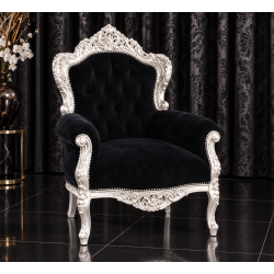 FAUTEUIL DE STYLE BAROQUE - Bois argent avec un velours noir - PROMO STOCKLes Meubles DOBOIS vous propose ce gros fauteuil baroque, fabriqué dans nos ateliers selon des méthodes traditionnelles.Structure en hêtre 100% massif avec finition à la feuille d’argent. Garniture avec assise confortable et revêtement en velours noir, pour un rendu élégant et contrasté.Ce fauteuil baroque imposant apportera beaucoup de caractère à un salon, une chambre ou un espace de réception.Ce modèle peut également être fabriqué sur commande avec un large choix de tissus, velours, lin, coton, simili cuir, cuir ainsi que différentes finitions de bois.Livraison assurée par nos soins, avec protection du fauteuil dans des couvertures et mousses de calage pendant le transport. 