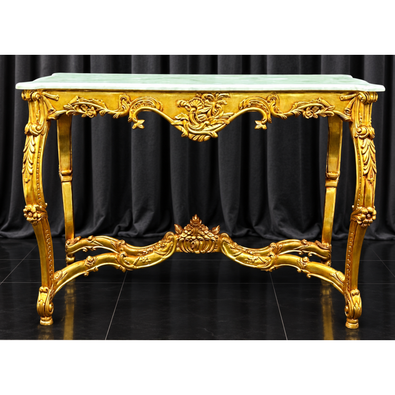 CONSOLE STYLE BAROQUE - FEUILLE D'OR - MARBRE Blanc - 115cmMagnifique Console Baroque en bois de hêtre massif patiné à la feuille feuille d'or. Fabrication dans nos atelier en bois de hêtre 100% massif, sculpté à la main, chaque pièce est donc unique. Plateau en Marbre blanc.Possibilité de fabrication sur mesure avec choix des dimensions, de la forme, du modèle et des finitions : bois laqué, vernis ou marqueterie. Consultez notre catalogue pour découvrir toutes les options disponibles.