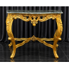 CONSOLE BAROQUE DORÉE À LA FEUILLE D’OR - MARBRE NOIR - 110 CM - PRIX PROMO -20%Magnifique console de style baroque en hêtre 100 % massif, sculptée à la main dans nos ateliers et patinée à la feuille d’or. Son entretoise sculptée complète harmonieusement sa silhouette. Le plateau en marbre noir contraste avec la dorure et met en valeur le travail des sculptures. Chaque pièce est unique.Largeur : 110 cm. Modèle disponible en stock. Promotion de 20 % : 1 056 € au lieu de 1 320 €.Fabrication sur mesure possible avec choix des dimensions, de la forme, du modèle et des finitions : bois laqué, vernis ou marqueterie. Consultez notre catalogue pour découvrir les options disponibles.Livraison possible par nos soins, protégée par couvertures et mousses, partout en France et en Europe continentale sur devis. En France, le tarif de livraison est identique partout, quelle que soit la distance à parcourir et quel que soit le volume de la commande.